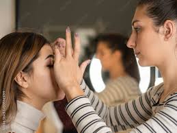 backse scene makeup artist applying