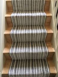 grey striped carpet runner on stairs