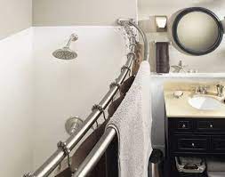 bathroom with a curved shower rod