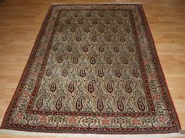old qum rug with all over boteh design