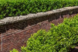 Tall Red Brick Retaining Wall With