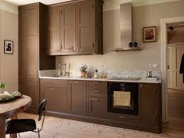 brown kitchen cabinets in a ious