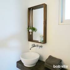 frame a bathroom mirror with a ledge