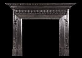 A Polished Cast Iron Fireplace In The