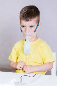 small child treats bronchitis inhaler