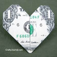Folding money into a heart. Dollar Bill Heart Origami