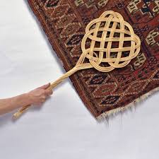 vine style rattan carpet beater by