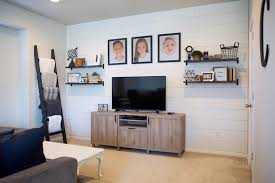 basement with white shiplap accent wall