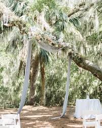 a wedding ceremony held beneath trees