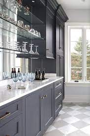 blue bar cabinets with floating glass