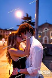 affectionate young couple kissing inon