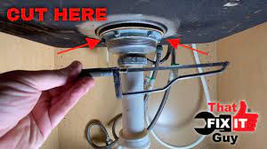 remove a stuck kitchen sink strainer