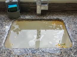 how to fix a kitchen sink clogged on