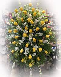 yellow love spray miguez funeral home