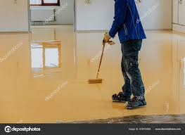 worker coating floor self leveling