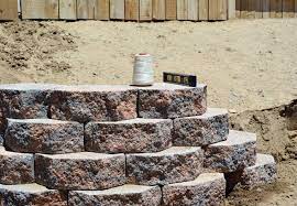 Large retaining wall blocks are thick, take more space and last for a long time. Building A Retaining Wall 8 Dos And Don Ts Bob Vila