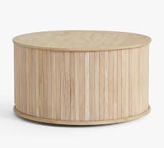 Drum storage coffee table this coffee table has a metal drum base (your choice of brass or bronze finish), mango wood top, and so many hidden storage possibilities with an easy open lift top. Arlo 31 Tambour Round Storage Coffee Table Pottery Barn