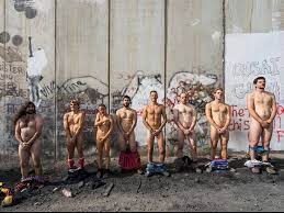 Naked clown activists issue apology to Palestinians after protesting at  wall separating Israel with West Bank | The Independent | The Independent