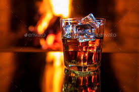 Whiskey With Ice Near The Fireplace