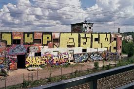 When graffiti is written legally on walls and buildings, it creates an outdoor art mural. Graffiti Wikipedia