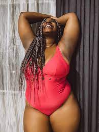 Large black woman in swimsuit laughing brightly · Free Stock Photo
