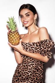 beautiful y woman with pineapple in