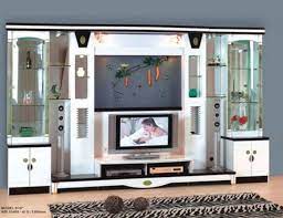 The two closed cabinets at the bottom of the tv unit are ideal for preserving accessories like speakers, chargers etc. Latest Showcase Designs For Home Interior Design Apartment Small Hall Interior Design House Interior Design Styles