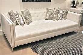 white faux leather tufted deep sofa