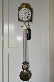 A French Brass Cased Wall Clock With
