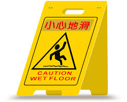 caution wet floor sign in english and