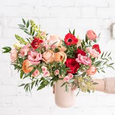 Insert the first flower into the floral foam and surround them with other flowers in a circular pattern. Farmgirl Fresh Ceo Christina Stembel Shows You How To Arrange Flowers In 5 Easy Steps