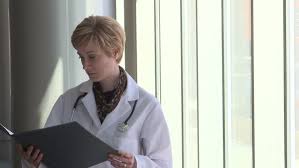 Female Doctor Reading The Patients Stock Footage Video 100 Royalty Free 2063312 Shutterstock