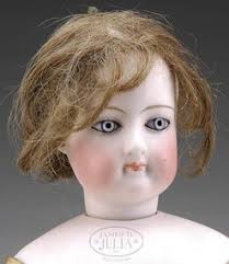 Wood-bodied French Fashion Lady doll, most likely made by Francois Gaultier, with a swivel neck, blue glass paperweight eyes, and a closed mouth, ... - 67-01