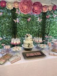 What a sweet baby shower! Enchanted Garden Dessert Table Girl Baby Shower Decorations Spring Baby Shower Baby Shower Dessert Table