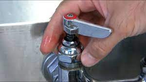 How to fix a leaking commercial wall mounted two valve faucet - YouTube