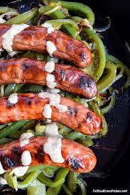 brats with grilled peppers onions