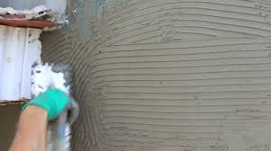 hands manual worker wall plastering