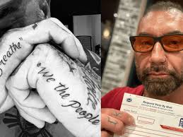 Dave bautista got a small 'sun' tattoo that encircles his belly button. Dave Bautista Gets I Can T Breathe Tattoo Tattoo Ideas Artists And Models