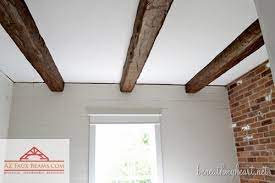 Installing Faux Wood Beams In Our