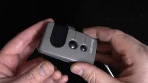 How to change the battery in a garage door opener remote - YouTube