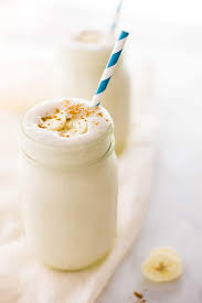 close up photo of banana protein shake ready to be served and enjo