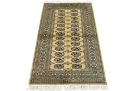beige wool hand knotted oriental rug