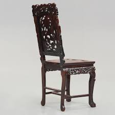 Of qing dynasty, presented on a wood stand; A Chinese Wooden Chair Qing Dynasty 19th Century Bukowskis