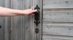 Hand Opening A Wooden Garden Shed Door