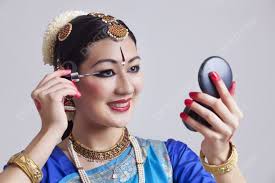 beautiful bharatanatyam dancer applying