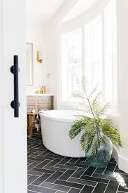 white bay window bathtub on dark gray