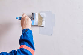Painting Wall With Help Of Paint Brush
