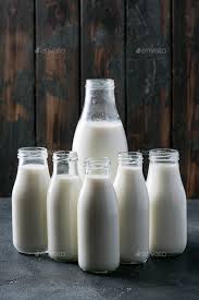 Fresh Milk In Diffe Glass Bottles