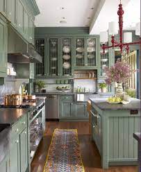 Chic vintage green kitchen design with mint green kitchen cabinets, green crown molding, farmhouse sink, marble counter tops, white kitchen island and subway tiles backsplash. 31 Green Kitchen Design Ideas Paint Colors For Green Kitchens