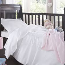 white cot bed bedding